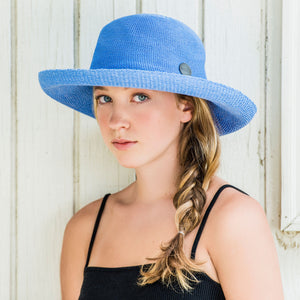 Woman wearing a UPF sun hat Carkella by Wallaroo, Hydrangea