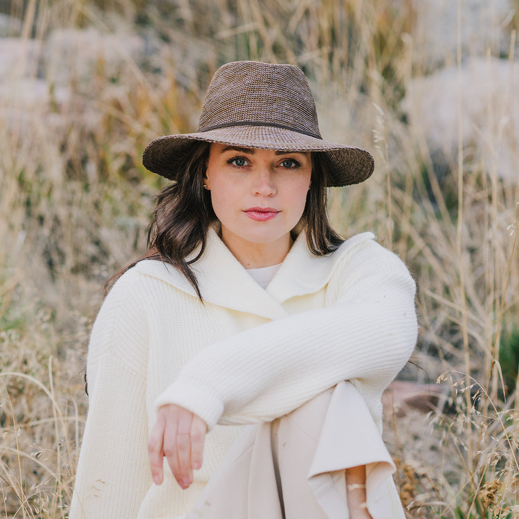 Woman wearing a fedora sun hat by Wallaroo, Suede