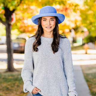 woman wearing a wide brim sun protection hat by Wallaroo