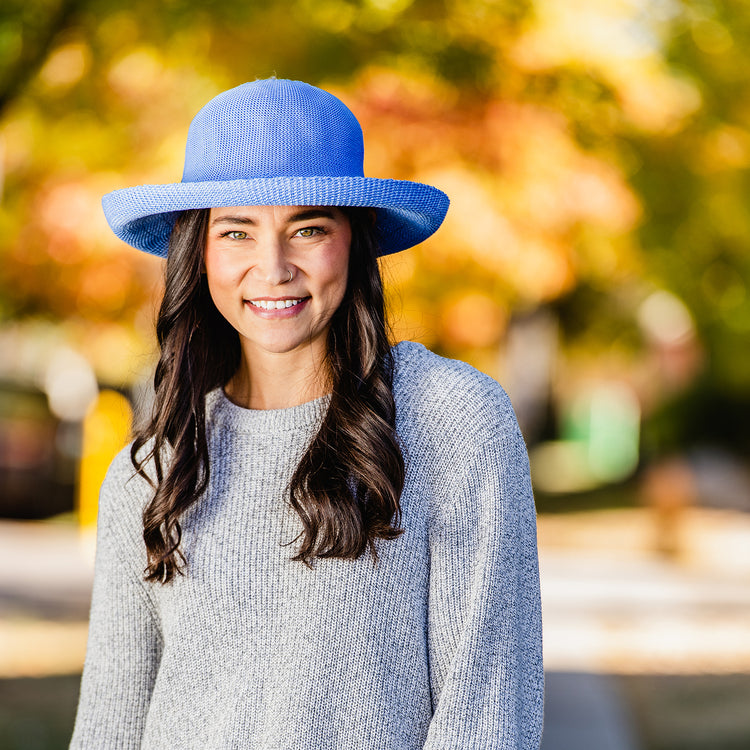 woman wearing a wide brim sun protection hat by Wallaroo, Hydrangea