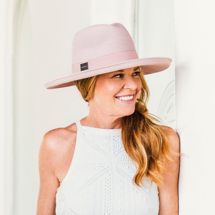 Woman wearing a Big Wide Brim Fedora Style Vivian UPF Sun Hat in Dusty Rose by Carkella