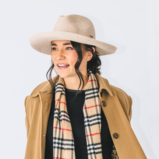 Woman Wearing a UPF Packable Big Wide Brim Fedora Style Vivian Sun Hat by Carkella, White Beige
