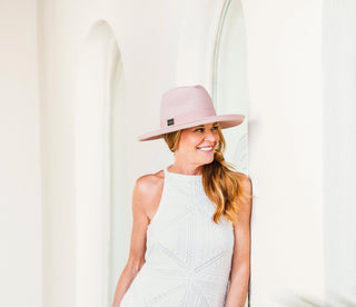 Woman wearing a big wide brim sun hat by Wallaroo