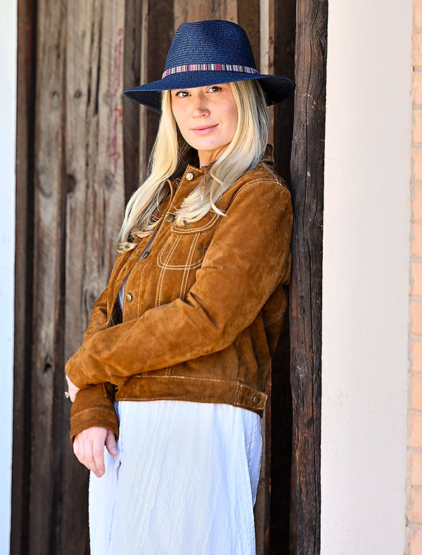 Woman standing outside while wearing a fedora sun hat by Wallaroo