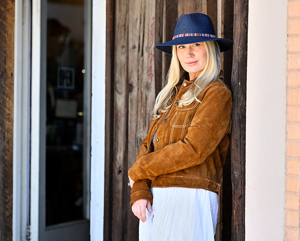 Woman standing outside while wearing a fedora style sun hat by Wallaroo