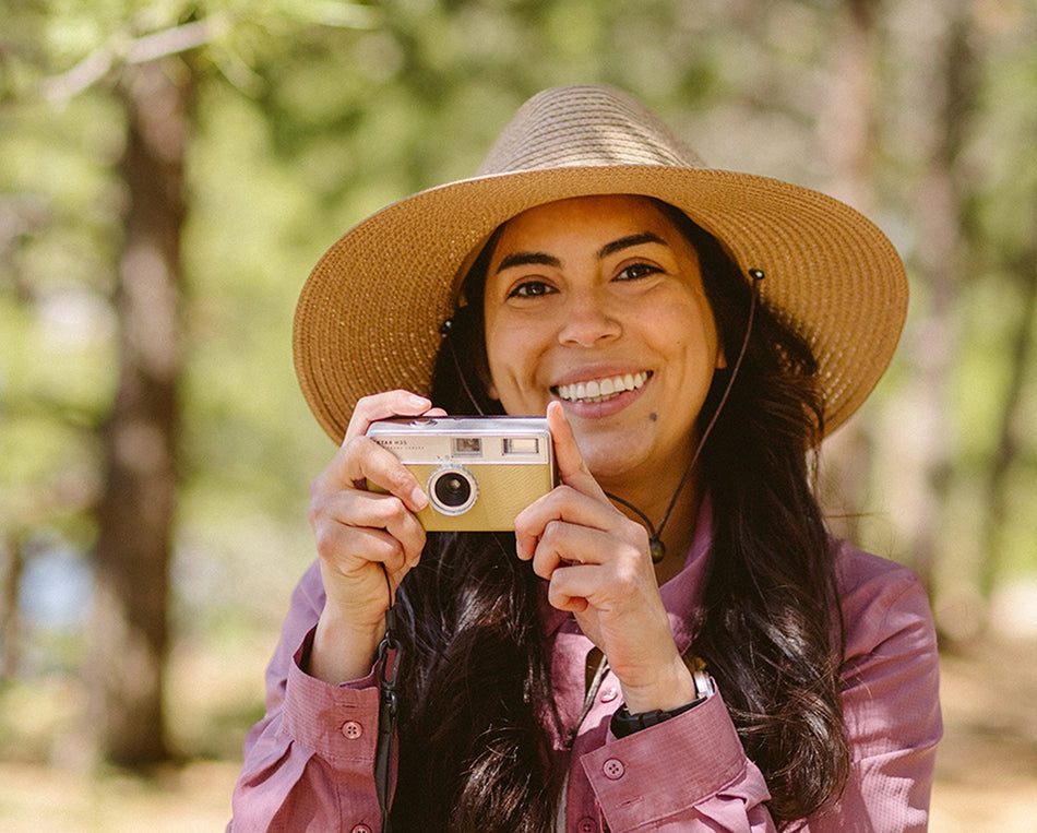 Woman wearing a big wide brim sun hat by Wallaroo