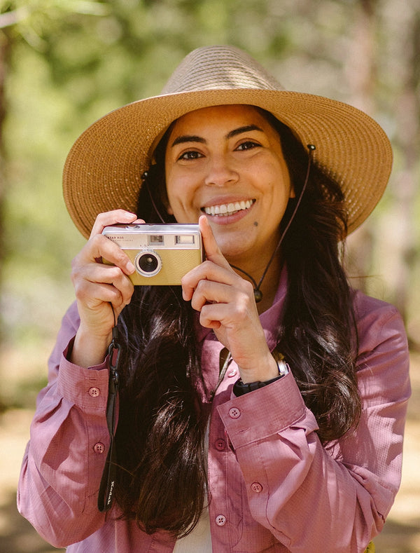 Woman wearing a big wide brim sun hat by Wallaroo