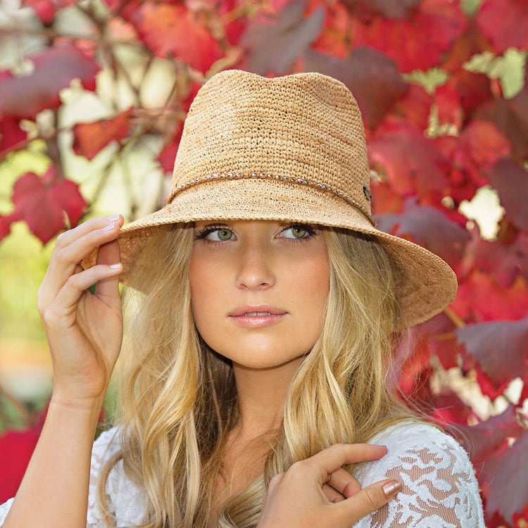 Woman Wearing a Big Wide Brim Fedora Style Malibu Straw Sun Hat from Wallaroo