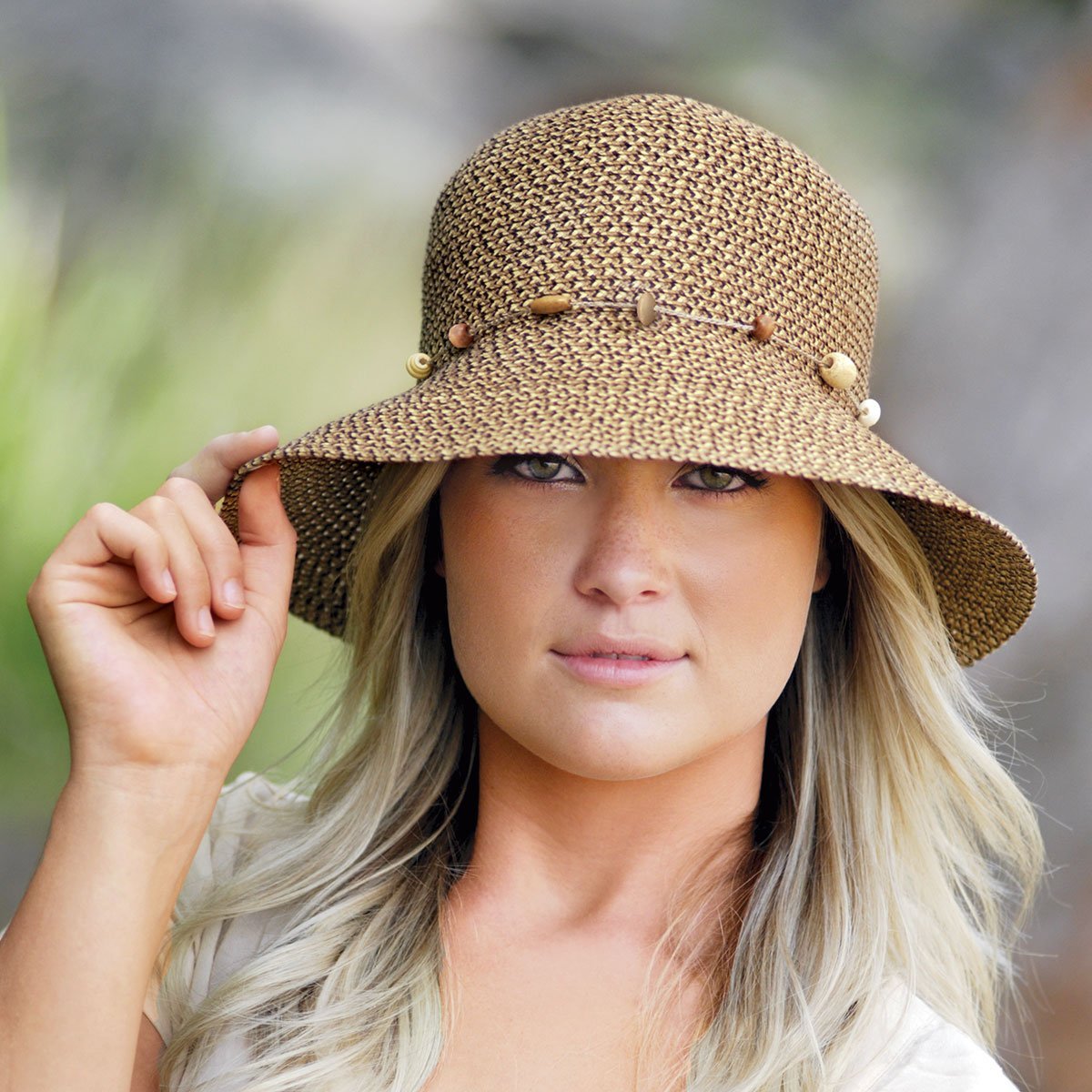 Featuring Woman Wearing UPF Packable Bucket Style Naomi Sun Hat in Mixed Brown from Wallaroo