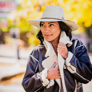 Woman Wearing Unisex Big Wide Brim Fedora Style Tulum Straw Sun Hat from Wallaroo