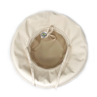 Inside of Women's Packable Wide Brim Seaside UPF Sun Hat with Chinstrap in Natural from Wallaroo